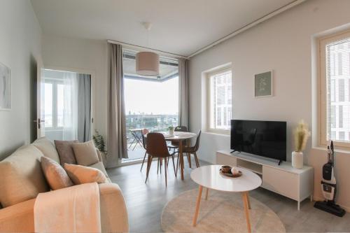 Zajednički dnevni boravak / prostorija s TV-om, Pramea Apartments Matkatupa in Kuopio Zajednički dnevni boravak / prostorija s TV-om, Pramea Apartments Matkatupa in Kuopio