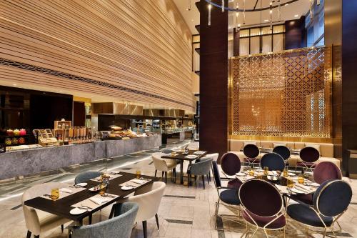 Restaurant, AlRayyan Hotel Doha, Curio Collection by Hilton near Al Udeid Air Base Restaurant, AlRayyan Hotel Doha, Curio Collection by Hilton near Al Udeid Air Base