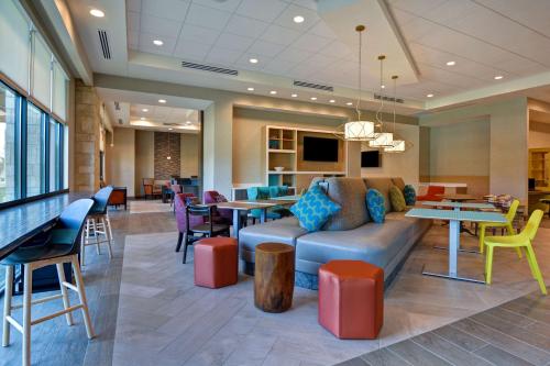 Lobby, Home2 Suites by Hilton Orlando Flamingo Crossings in Disney West Area Lobby, Home2 Suites by Hilton Orlando Flamingo Crossings in Disney West Area