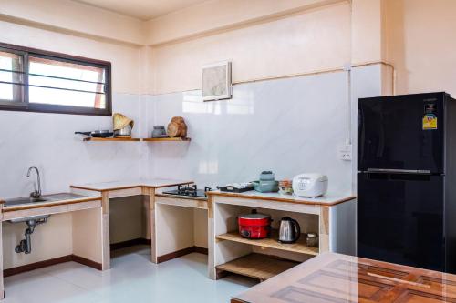 Kitchen, เฮือนดาราโฮมสเตย์ in Kosamphi Nakhon Kitchen, เฮือนดาราโฮมสเตย์ in Kosamphi Nakhon