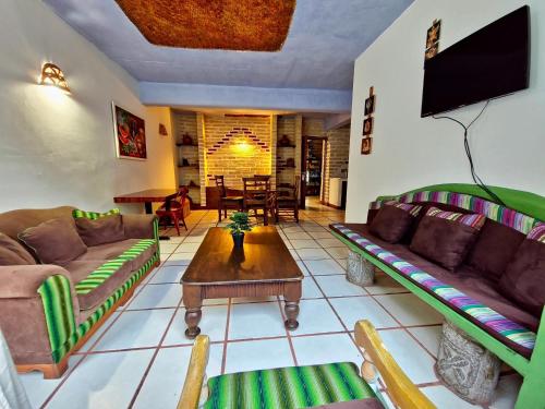 Shared lounge/TV area, Eco Suites Uxlabil Guatemala in Guatemala City Shared lounge/TV area, Eco Suites Uxlabil Guatemala in Guatemala City