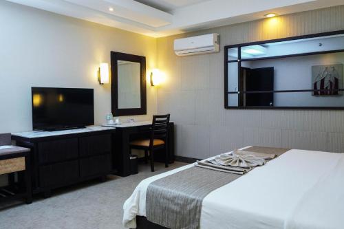 Shared lounge/TV area, Coron Westown Resort in Coron Shared lounge/TV area, Coron Westown Resort in Coron