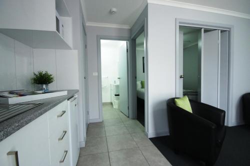 مطبخ, Golden Palms Motel in Belmont مطبخ, Golden Palms Motel in Belmont