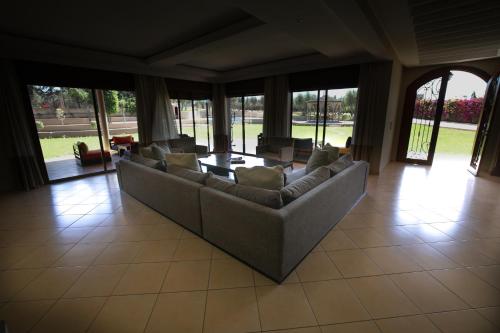 Shared lounge/TV area, Villa Tizra - guest house in Bouznika Shared lounge/TV area, Villa Tizra - guest house in Bouznika