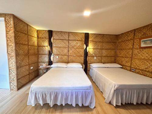 Bamboo House Beach Lodge & Restaurant in Aninuan Bamboo House Beach Lodge & Restaurant in Aninuan