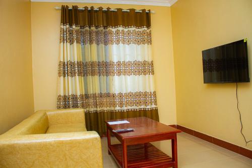 Shared lounge/TV area, The Connected Living Lodge with AC ,Wi-Fi and Netflix in Tanga Shared lounge/TV area, The Connected Living Lodge with AC ,Wi-Fi and Netflix in Tanga