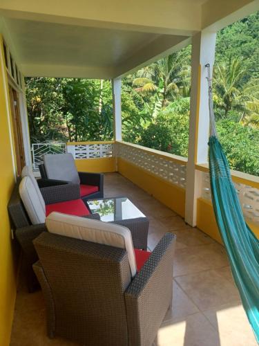 Varanda/terraço, Mango Garden Cottages in Saint George Varanda/terraço, Mango Garden Cottages in Saint George