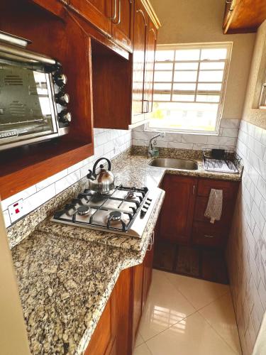 Kitchen, Cozy Modern Upstairs 2 Bed A/C Apt Near 2 Everything in Long Bay Kitchen, Cozy Modern Upstairs 2 Bed A/C Apt Near 2 Everything in Long Bay