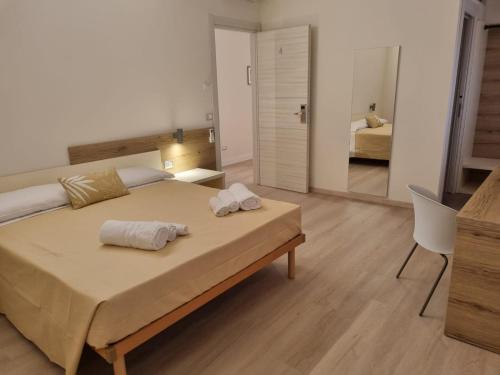 Simona Rooms in ปอร์โตกันโนเน Simona Rooms in ปอร์โตกันโนเน