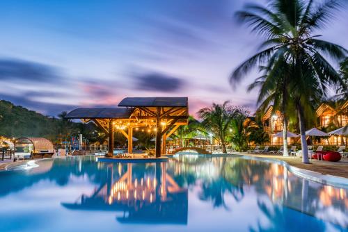 Pool lit up at night at a Cartagena all inclusive resort