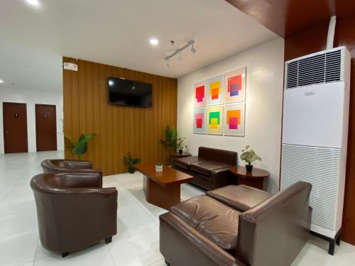 Shared lounge/TV area, Cris Inn-Tagum in Tagum Shared lounge/TV area, Cris Inn-Tagum in Tagum