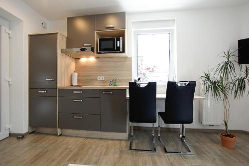 Kitchen, JG-Haus Ferienwohnungen in Bullay Kitchen, JG-Haus Ferienwohnungen in Bullay