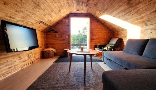 Közös társalgó / TV, Cozy Cabin Styled Loft in Kiruna városközpont Közös társalgó / TV, Cozy Cabin Styled Loft in Kiruna városközpont