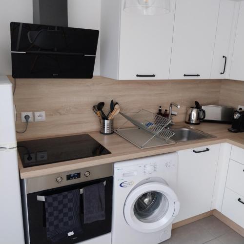 Kitchen, Appartement cosy proche Disney in Ferrieres-en-Brie Kitchen, Appartement cosy proche Disney in Ferrieres-en-Brie