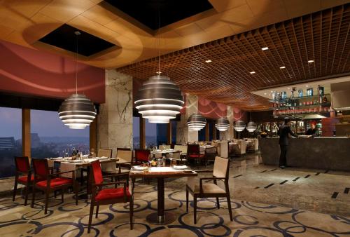 Restaurant, The Leela Ambience Gurugram Hotel & Residences - The Luxury Urban Sanctuary in Gurgaon Restaurant, The Leela Ambience Gurugram Hotel & Residences - The Luxury Urban Sanctuary in Gurgaon