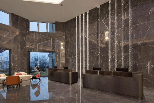 Hol, Ramada by Wyndham Qingdao Jiaodong International Airport in Qingdao Hol, Ramada by Wyndham Qingdao Jiaodong International Airport in Qingdao