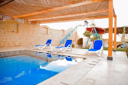 Swimming pool, كمبوند قرية تونس in Faiyum Swimming pool, كمبوند قرية تونس in Faiyum
