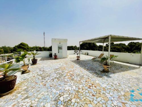 Terraza/balcón, KEUR MATY Charmante et Moderne Villa 5 chambres, 5 salles de bains à Warang (KEUR MATY Charmante et Moderne Villa 5 chambres, 5 salles de bains a Warang) in Ouoran Terraza/balcón, KEUR MATY Charmante et Moderne Villa 5 chambres, 5 salles de bains à Warang (KEUR MATY Charmante et Moderne Villa 5 chambres, 5 salles de bains a Warang) in Ouoran