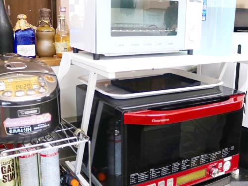 Kitchen, GUEST HOUSE てぃんが〜ら in Yomitan Kitchen, GUEST HOUSE てぃんが〜ら in Yomitan