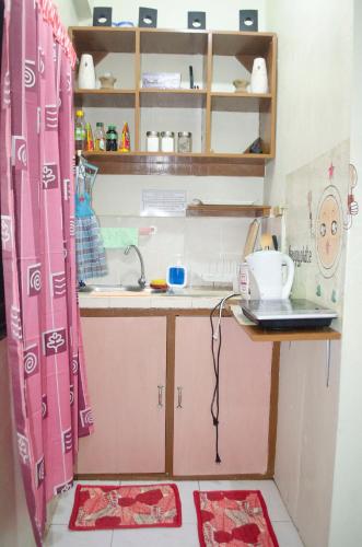 Kitchen, Sakura Staycation Netflix, Game room and Videoke in Valenzuela Kitchen, Sakura Staycation Netflix, Game room and Videoke in Valenzuela