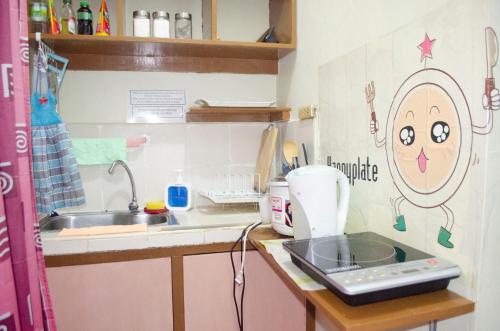 Kitchen, Sakura Staycation Netflix, Game room and Videoke in Valenzuela Kitchen, Sakura Staycation Netflix, Game room and Videoke in Valenzuela
