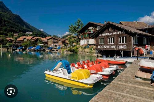 Romantic Swiss Alp Iseltwald with Lake & Mountains in Iseltwald Romantic Swiss Alp Iseltwald with Lake & Mountains in Iseltwald