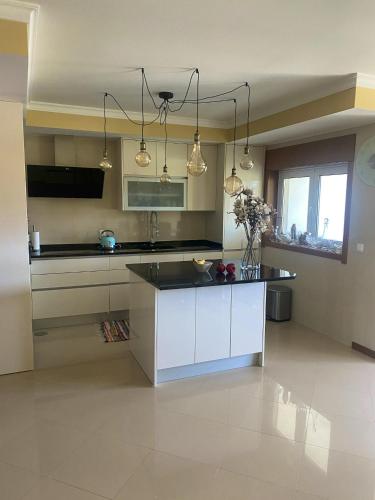 Kitchen, Welcoming house with terrace and garden in Barra de Mira in Praia Da Mira Kitchen, Welcoming house with terrace and garden in Barra de Mira in Praia Da Mira