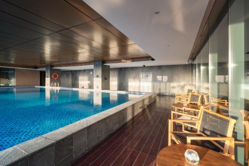 Swimming pool, Oakwood Hotel & Residence Surabaya in Kenjeran Swimming pool, Oakwood Hotel & Residence Surabaya in Kenjeran