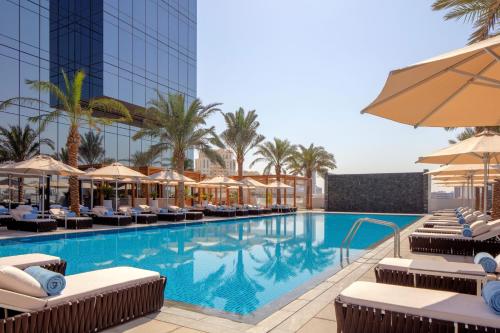 Swimming pool, The First Collection at Jumeirah Village Circle, a Tribute Portfolio Hotel in Dubailand Swimming pool, The First Collection at Jumeirah Village Circle, a Tribute Portfolio Hotel in Dubailand