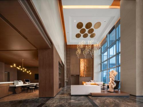 Jagatud salong / TV-ala, Holiday Inn Shijiazhuang High Tech Zone By IHG in Shijiazhuang Jagatud salong / TV-ala, Holiday Inn Shijiazhuang High Tech Zone By IHG in Shijiazhuang
