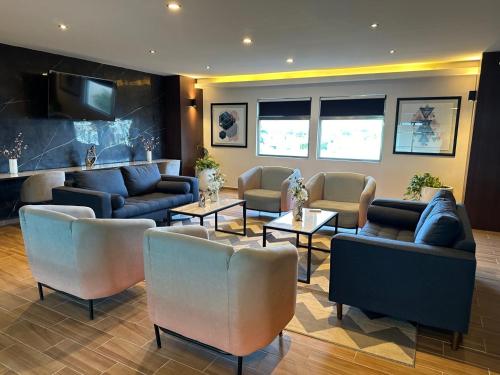 Shared lounge/TV area, Mision Express Merida Altabrisa in Merida Shared lounge/TV area, Mision Express Merida Altabrisa in Merida