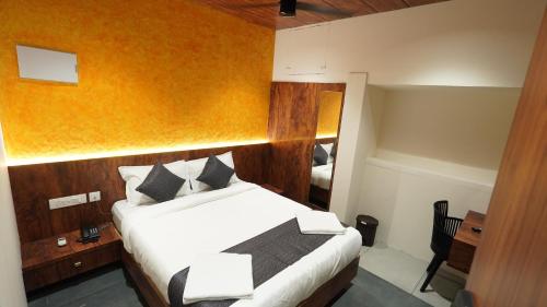 Ágy, Hotel Hive Inn - Kozhikode in Kózsikóde / Kálikut Ágy, Hotel Hive Inn - Kozhikode in Kózsikóde / Kálikut