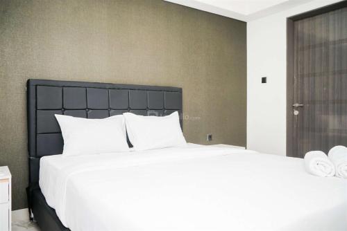 Nice and Restful 1BR Apartment Carstensz Residence By Travelio