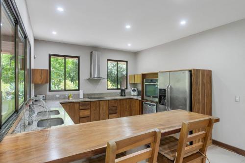 Spacious 3-Bedroom Coastal Home with Shared Pool, Outdoor Living & Steps to Playa Potrero in Potrero Spacious 3-Bedroom Coastal Home with Shared Pool, Outdoor Living & Steps to Playa Potrero in Potrero