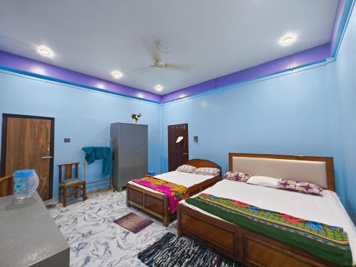Bed, RG Homestay in Sivasagar Bed, RG Homestay in Sivasagar