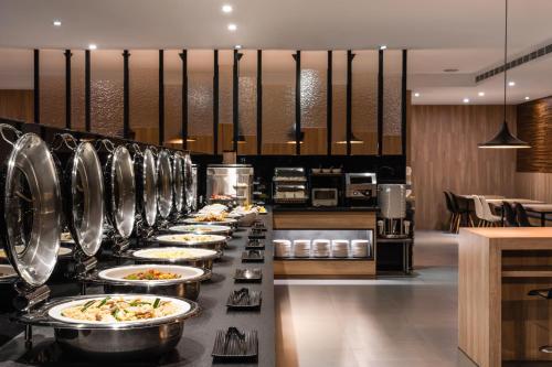 Étterem, The Riverside Hotel International near Kaohsiungi nemzetközi repülőtér Étterem, The Riverside Hotel International near Kaohsiungi nemzetközi repülőtér