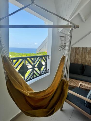 Varanda/terraço, Duplex cozy avec superbe vue mer et accès piscine proche des plages (Duplex cozy avec superbe vue mer et acces piscine proche des plages) in Mare Gaillard Varanda/terraço, Duplex cozy avec superbe vue mer et accès piscine proche des plages (Duplex cozy avec superbe vue mer et acces piscine proche des plages) in Mare Gaillard