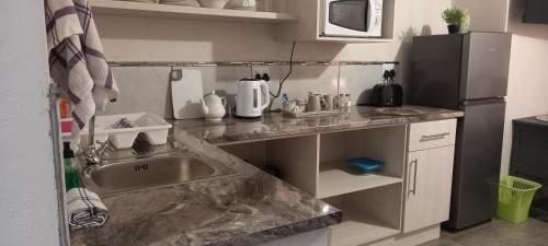 Kitchen, 1-On-Scott Garden Suites in Somerset East Kitchen, 1-On-Scott Garden Suites in Somerset East