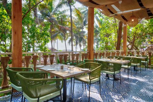 Restaurant, Aralea Beach Resort By Stone Wood in Morjim Restaurant, Aralea Beach Resort By Stone Wood in Morjim
