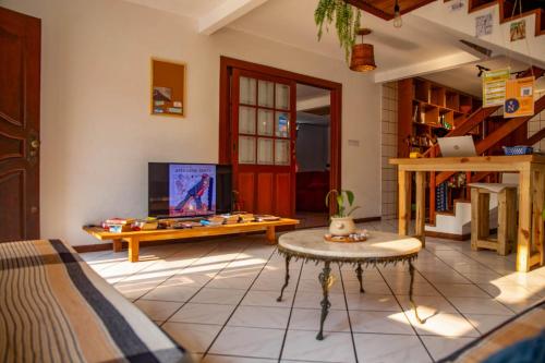 Shared lounge/TV area, Nomades Beach - Adventure Hostels & Coworking in Barra da Lagoa Beach Shared lounge/TV area, Nomades Beach - Adventure Hostels & Coworking in Barra da Lagoa Beach