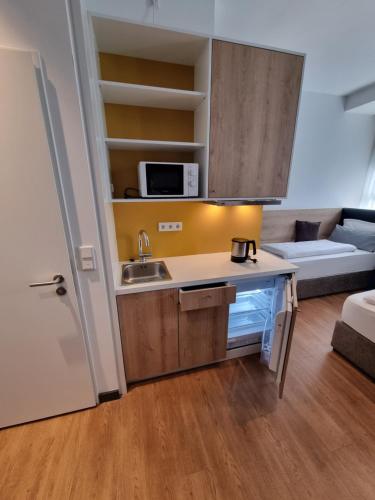Konyha, my MINGA Airport serviced Apartments in Hallbergmoos Konyha, my MINGA Airport serviced Apartments in Hallbergmoos