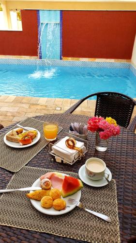 Cibo e bevande, Hotel Rosa da Ilha Guaruja - Perto do Mar com piscina in Guaruja Cibo e bevande, Hotel Rosa da Ilha Guaruja - Perto do Mar com piscina in Guaruja