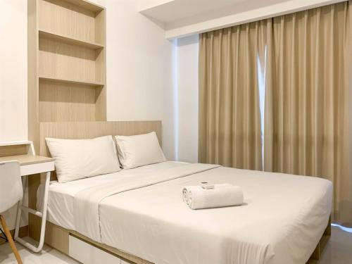 Homey and Functional 2BR Tokyo Riverside PIK 2 Apartment By Travelio