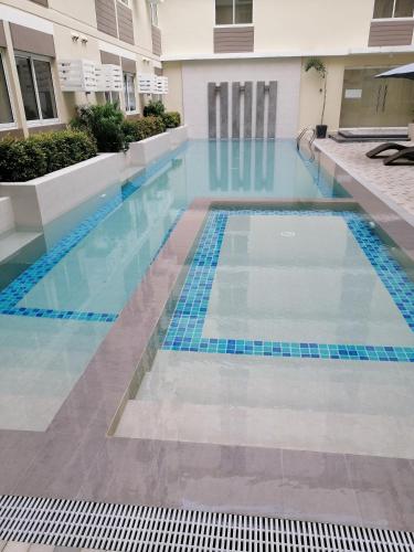 Swimming pool, A cozy staycation 4 pax near schools! in Silang Swimming pool, A cozy staycation 4 pax near schools! in Silang