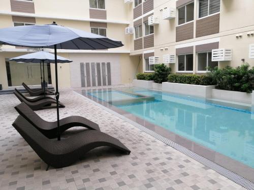 Swimming pool, A cozy staycation 4 pax near schools! in Silang Swimming pool, A cozy staycation 4 pax near schools! in Silang