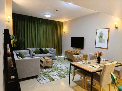 Shared lounge/TV area, 369 Stays- 1 Bedroom Apartment in Sports City near Dubai Sports City Shared lounge/TV area, 369 Stays- 1 Bedroom Apartment in Sports City near Dubai Sports City