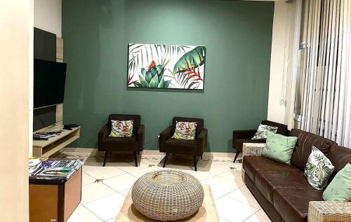 Lounge/area TV in comune, Hotel Rosa da Ilha Guaruja - Perto do Mar com piscina in Guaruja Lounge/area TV in comune, Hotel Rosa da Ilha Guaruja - Perto do Mar com piscina in Guaruja
