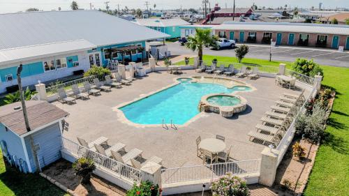 Piscina, Shark Reef Resort Motel & Cottages in Port Aransas (TX) Piscina, Shark Reef Resort Motel & Cottages in Port Aransas (TX)