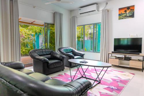 Shared lounge/TV area, Thooru Stay in Haa Alif Atoll Shared lounge/TV area, Thooru Stay in Haa Alif Atoll