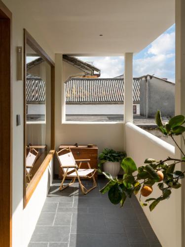 Rõdu/terrass, Dali Shijing Homestay in Dali Rõdu/terrass, Dali Shijing Homestay in Dali